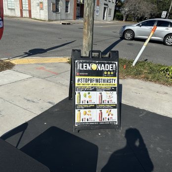 Yellow Bodega - Corner sign with juices and ingredient list! - Juice Bars & Smoothies Near Me - Jacksonville, Florida