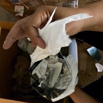 FlatRate Moving - Torn tissue-like paper used to wrap dishes. - Movers Near Me FlatRate Moving - Torn tissue-like paper used to wrap dishes. - Movers Near Me