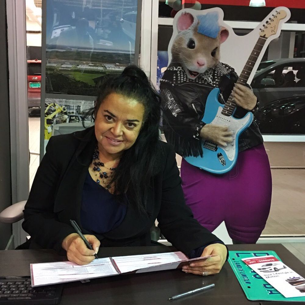International Auto Group - Our British salesperson Pearl filling out the paperwork. - Car Dealers Near Me - Orland Park, Illinois International Auto Group - Our British salesperson Pearl filling out the paperwork. - Car Dealers Near Me - Orland Park, Illinois