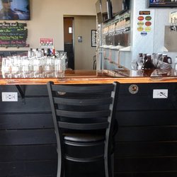 Copper Top Tap House and Growler Fills - Charging stations underneath bar with USB ports.
