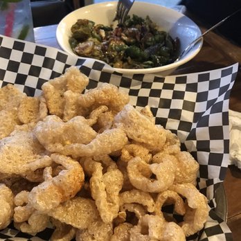 Lamplighter Public House - Fresh sizzling pork rinds and succulent Brussels sprouts with bacon and honey jalepeño sauce. Amazing! - American Near Me - Seattle, Washington