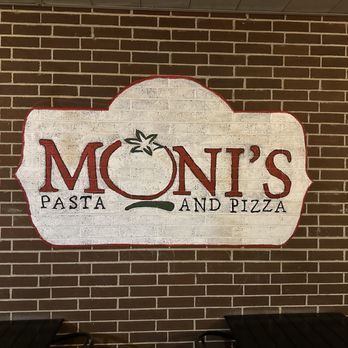 Moni's Pasta & Pizza - Store sign on patio seating - Pizza Near Me - Arlington, Texas Moni's Pasta & Pizza - Store sign on patio seating - Pizza Near Me - Arlington, Texas