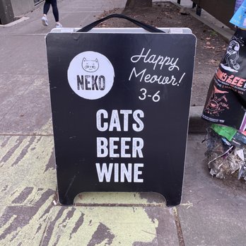 NEKO: A Cat Cafe - Sign on the sidewalk - Themed Cafes Near Me - Seattle, Washington NEKO: A Cat Cafe - Sign on the sidewalk - Themed Cafes Near Me - Seattle, Washington