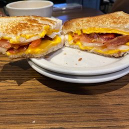 a half eaten sandwich on a plate