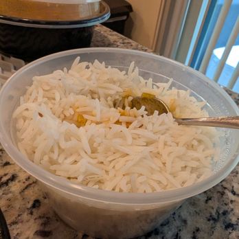 Kohinoor - Cumin rice (with some chana masala mess from the spoon) - Indian Near Me - Mashpee, Massachusetts