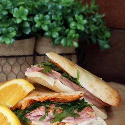 The Squeeze at the Beach - Italian Sandwich A flavorful combination of Italian meats, fresh green, roasted red peppers and our house-made italian sauce