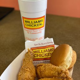 a basket of fried chicken and a cup of coffee