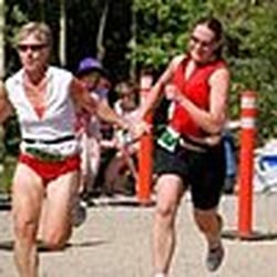 Karen M Hall - Karen helping a client across the line at her first triathlon event