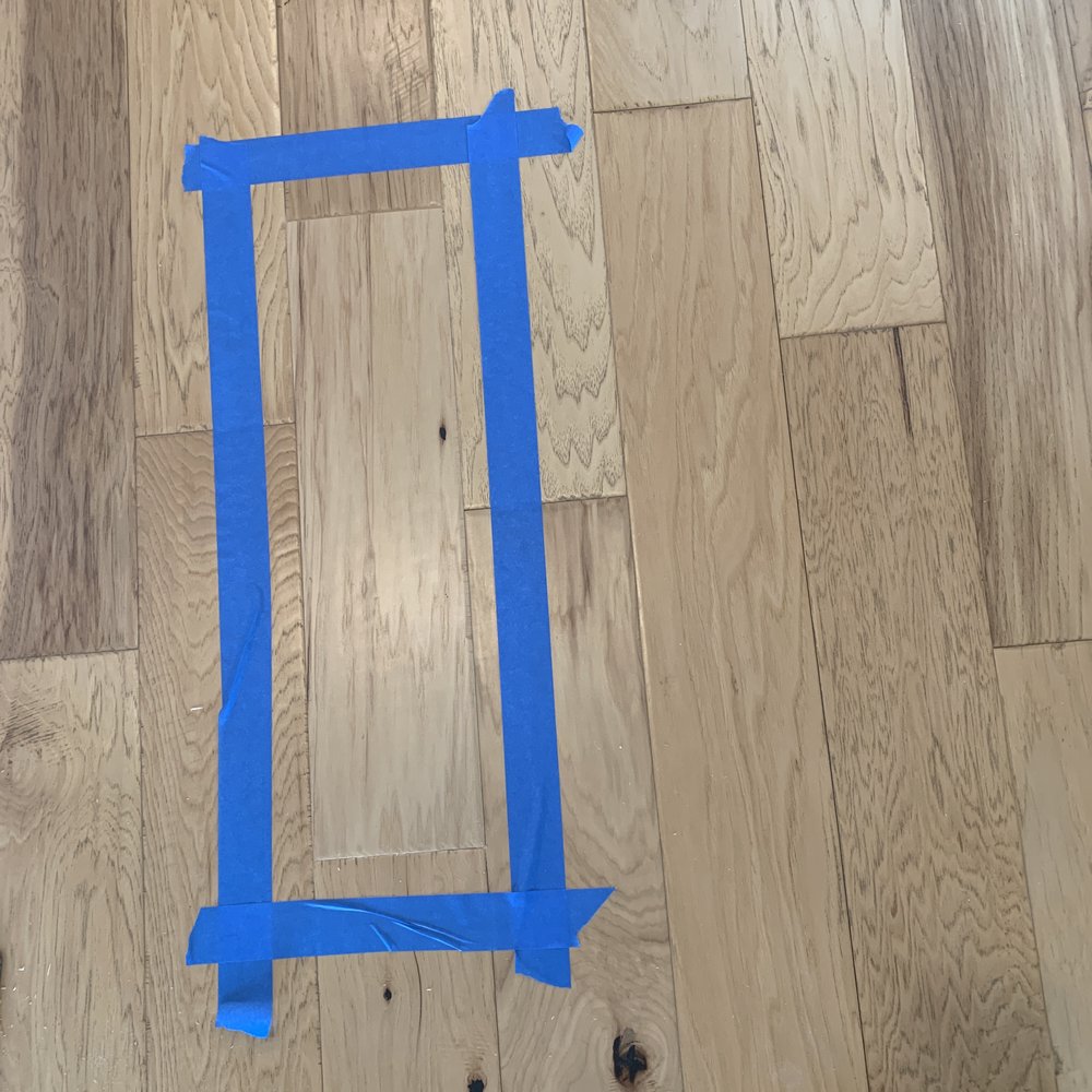 Lion Heart Remodel - a picture of a blue tape taped around a picture frame - Flooring Near Me Lion Heart Remodel - a picture of a blue tape taped around a picture frame - Flooring Near Me