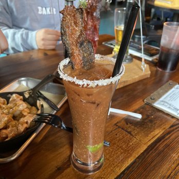 Sids Garage - Bloody Mary with jalapeño candied bacon - DIVINE - Burgers Near Me - Meridian, Idaho Sids Garage - Bloody Mary with jalapeño candied bacon - DIVINE - Burgers Near Me - Meridian, Idaho