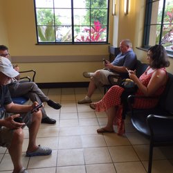 Kaiser Permanente Maui Lani Pharmacy - Waiting area with tv and magazines.