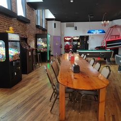 The Guilty Grind - Seating area with games