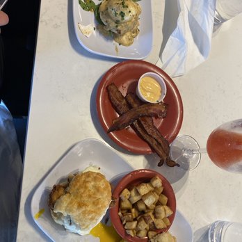 Ruby Sunshine Nashville - On the right- Buttermilk Biscuit Slider Duo with bacon and egg added. left-The Peacemaker (Chicken St Charles and bayou shrimp) - Breakfast & Brunch Near Me - Nashville, Tennessee Ruby Sunshine Nashville - On the right- Buttermilk Biscuit Slider Duo with bacon and egg added. left-The Peacemaker (Chicken St Charles and bayou shrimp) - Breakfast & Brunch Near Me - Nashville, Tennessee