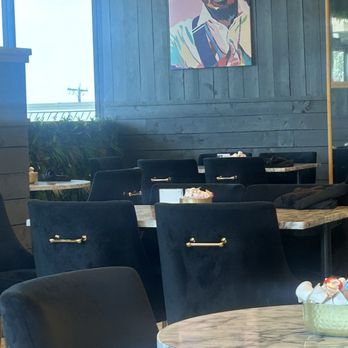 Flavor Rich Restaurant - Artwork. More tables and suede chairs - Breakfast & Brunch Near Me - San Antonio, Texas