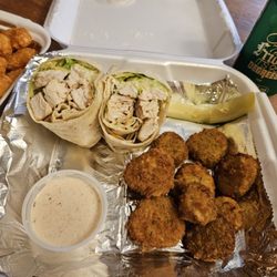 Sinkhole Saloon & Grill - Grilled chicken caesar wrap - fried pickles - tater tots