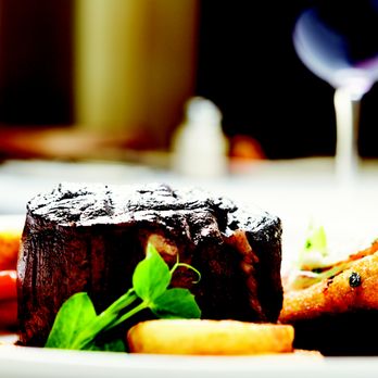 NOLA Steak - a plate of food and a glass of wine - Steakhouses Near Me - Harvey, Louisiana NOLA Steak - a plate of food and a glass of wine - Steakhouses Near Me - Harvey, Louisiana