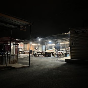 Snow's BBQ - Food carving to left, covered pits and eating in the middle, merch & bathrooms on right. - Barbeque Near Me - Lexington, Texas