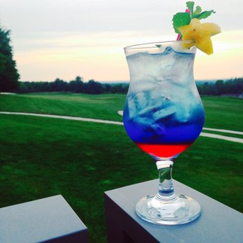 Harbor View Grill - a blue and red drink with a pineapple garnish - Burgers Near Me - Erie, Pennsylvania