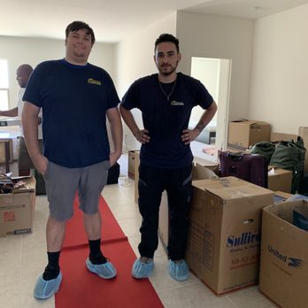 Property Mover - Anthony and Tristan after a job well done - Movers Near Me