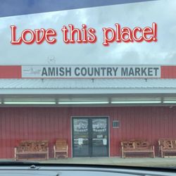 AMISH COUNTRY MARKET - Store front. Seasonal offerings outside.
