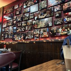 Pat's Pizza - Pics taken of former families having dinner at Pat's Pizza line the walls.