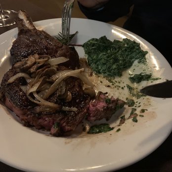 Chops Steakhouse - Cowboy ribeye medium with sautéed mushrooms and onions and creamed spinach. - Steakhouses Near Me - Patchogue, New York