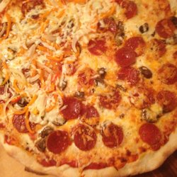 Divine Delicacies - Pizza scratch made, Pepperoni, sausage and extra cheese on half. Create your own style