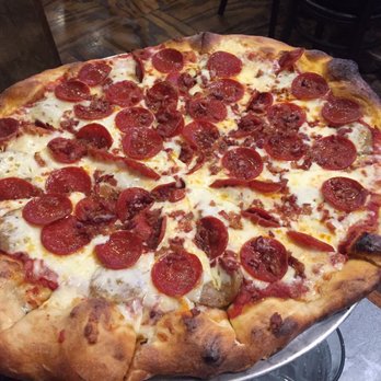 The Rail a Pizza Company - Sliced Italian sausage, pepperoni, bacon and extra Cheese pizza (16") - enough to share! - Pizza Near Me - Rogers, Arkansas