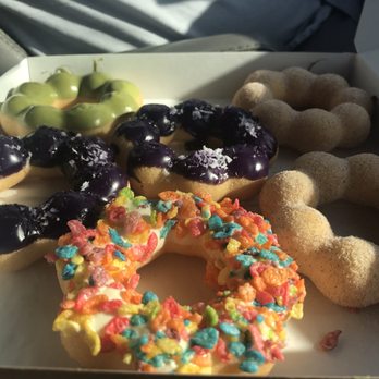 Le Creme - Matcha Mochi donut, Ube Coconut, Fruity Pebbles, and the remaining two are churro. - Desserts Near Me - San Jose, California Le Creme - Matcha Mochi donut, Ube Coconut, Fruity Pebbles, and the remaining two are churro. - Desserts Near Me - San Jose, California