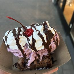 Brownie sundae with blackberry ice cream