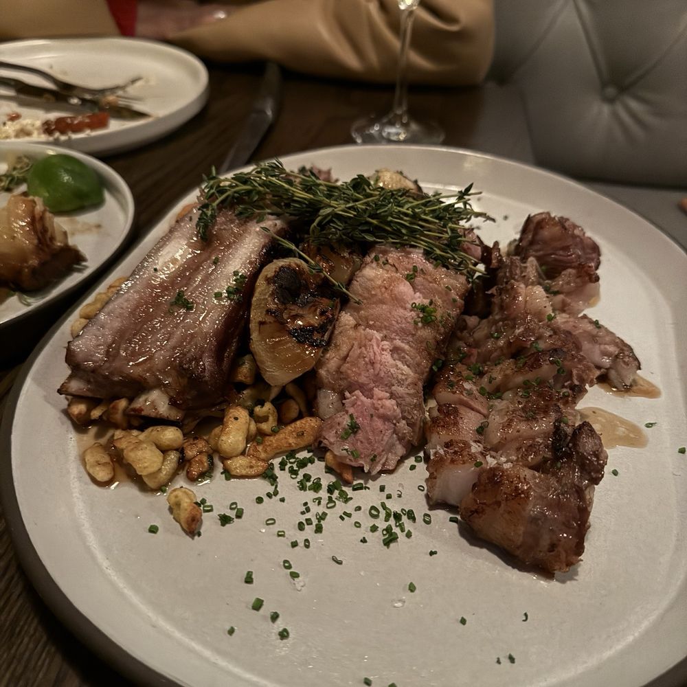 The Kitchen - Pork chop. Perfect. - New American Near Me - Austin, Texas