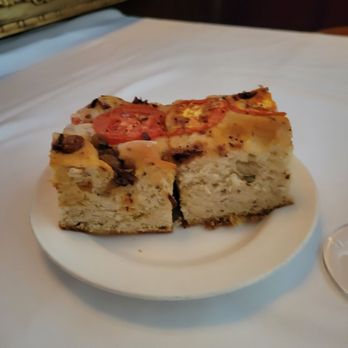 Grill 225 - Roll with tomatoes and raisins - Steakhouses Near Me - Charleston, South Carolina Grill 225 - Roll with tomatoes and raisins - Steakhouses Near Me - Charleston, South Carolina