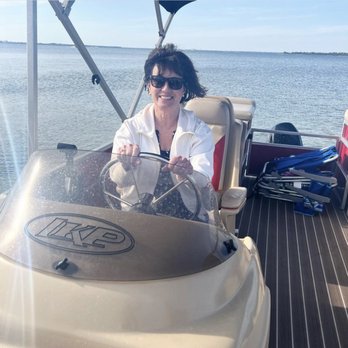 Lagoon Pontoons - My wife behind the wheel of a boat. Maybe her first time ever steering a boat. - Boating Near Me - Panama City Beach, Florida Lagoon Pontoons - My wife behind the wheel of a boat. Maybe her first time ever steering a boat. - Boating Near Me - Panama City Beach, Florida