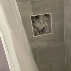 Stevens Home Designs - A niche space to place shower essentials