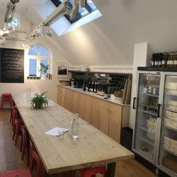 London Cheesemongers - Upstairs gathering are to enjoy cheese plates and wine.