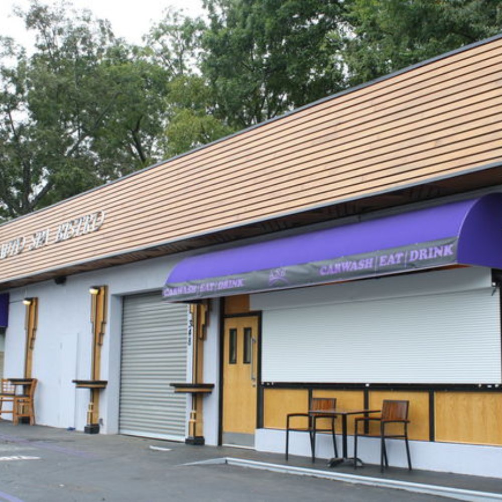Auto Spa Bistro - Exterior, Main Photo. The gold and purple carwash at the corner of 14th and State street - New American Near Me - Atlanta, Georgia