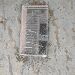 Courier-Journal Newspaper - Paper once again was thrown in the driveway in the pouring ran instead of being placed in my paper box WHERE IT SHOULD BE