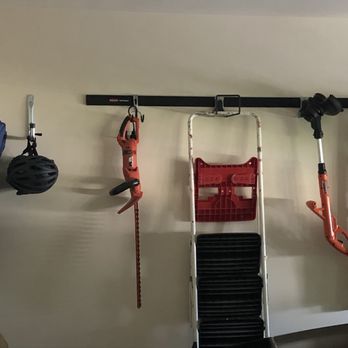 Helping Hands Handyman Services - Painted garage and installed system to hang tools/ladders - Handyman Near Me