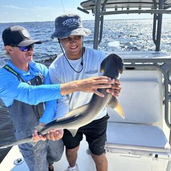 YACHTFISH Fishing Charters - The captain taking the kook out