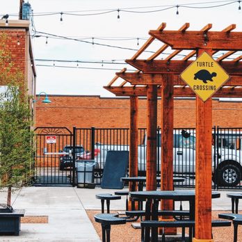 Toppled Turtle Brewing - a picnic area with tables and benches - Breweries Near Me - Dumas, Texas