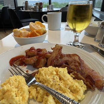 Le Bistro - a plate of breakfast food and a glass of wine - American Near Me - Quebec City, Quebec Le Bistro - a plate of breakfast food and a glass of wine - American Near Me - Quebec City, Quebec