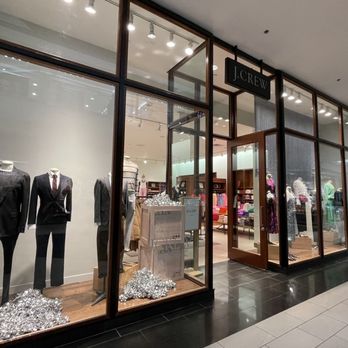 J.Crew - The storefront features large glass windows showcasing mannequins dressed in business and casual attire, with a sign reading 'J.Crew' above the entrance. - Men's Clothing Near Me - Austin, Texas