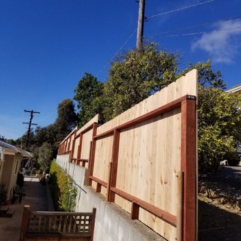 Miguel’s Landscaping - a wooden fence and a telephone pole - Fences & Gates Near Me Miguel’s Landscaping - a wooden fence and a telephone pole - Fences & Gates Near Me