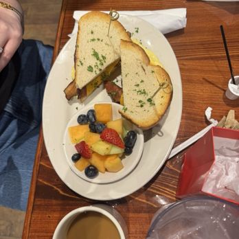 St Mary's Restaurant - Breakfast Sandwich with bacon and side of fruit - Breakfast & Brunch Near Me - Metairie, Louisiana St Mary's Restaurant - Breakfast Sandwich with bacon and side of fruit - Breakfast & Brunch Near Me - Metairie, Louisiana