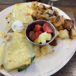Chickichanga with fried potatoes and fruit Bloody Mary to drink Chickichanga with fried potatoes and fruit Bloody Mary to drink