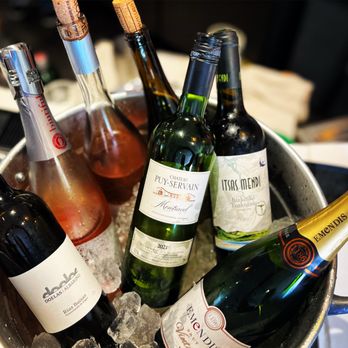 Pikoteo - a bucket full of wine bottles - Latin American Near Me - McLean, Virginia