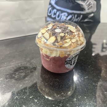 Cocobowlz Alpharetta - Açaí base, bananas, blueberries and strawberries, cacao nibs, almonds with peanut butter drizzle - Acai Bowls Near Me - Alpharetta, Georgia