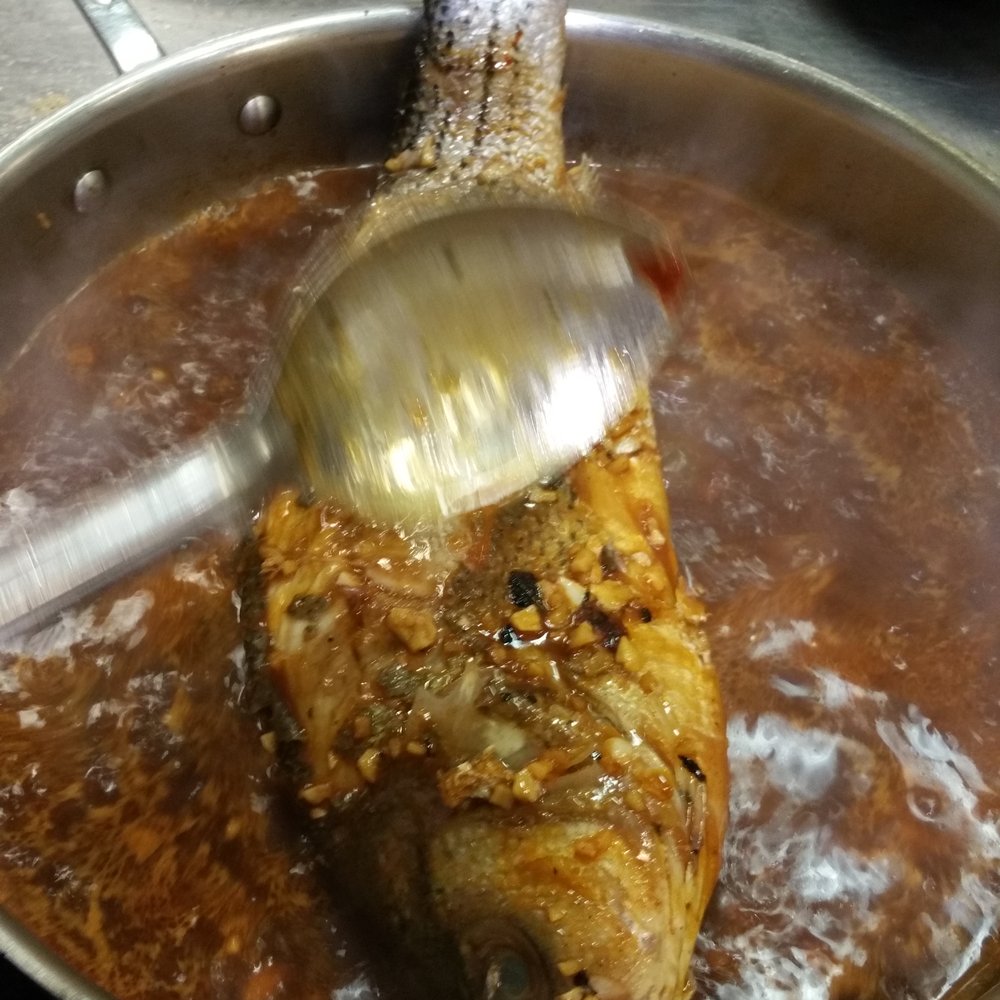 Central Market Cooking School - Basting the fish - Cooking Schools Near Me - Dallas, Texas Central Market Cooking School - Basting the fish - Cooking Schools Near Me - Dallas, Texas