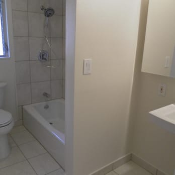Handyman Oahu - Bathroom renovation "AFTER" photo, w/ porcelain tiles w/ epoxy grout, drywall (carefully textured), new fixtures. - Handyman Near Me
