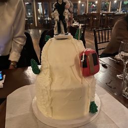 a man and woman on top of a cake a man and woman on top of a cake